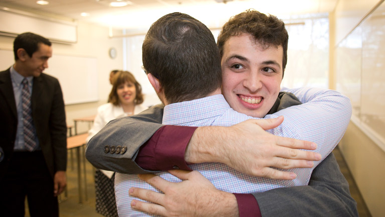 Student giving someone a hug