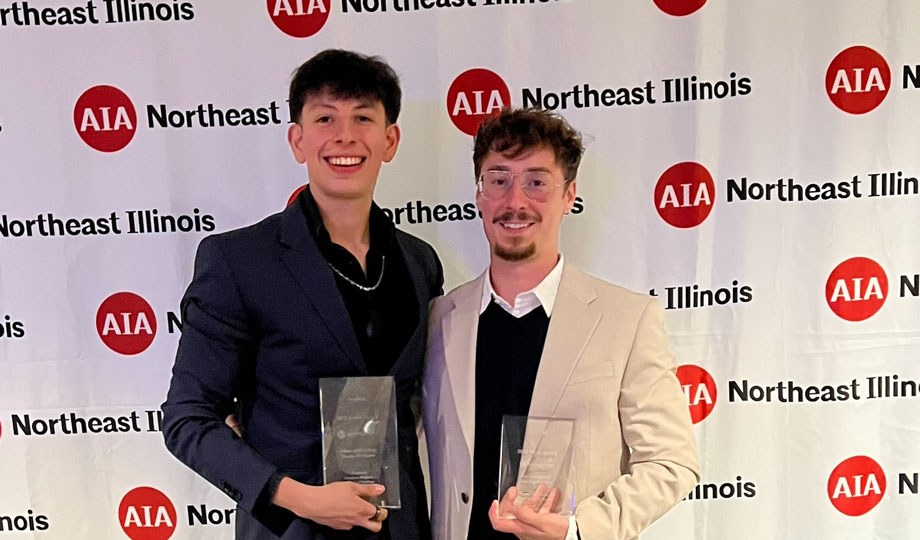 two AIA award winners with their award plaque