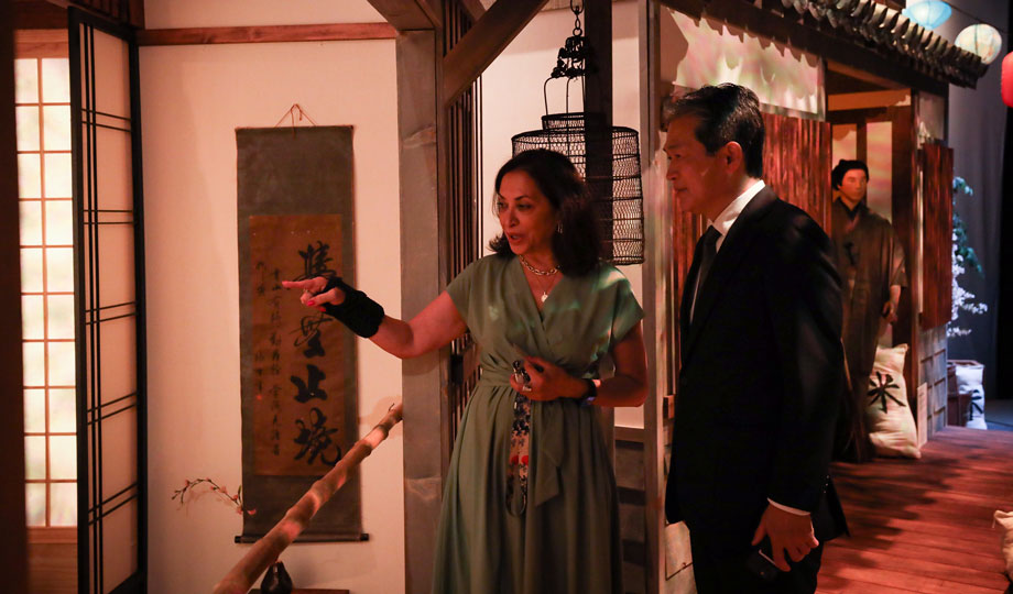 MAC Director Diana Martinez and Consul-General of Japan look at a painting at the "Hokusai and Ukiyo-e" exhibit at the Cleve Carney Museum of Art