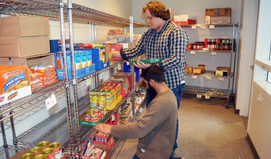 students pack food in the Fuel Pantry