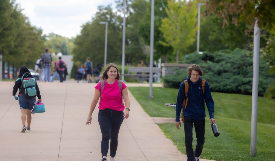 two students walk outside COD's campus